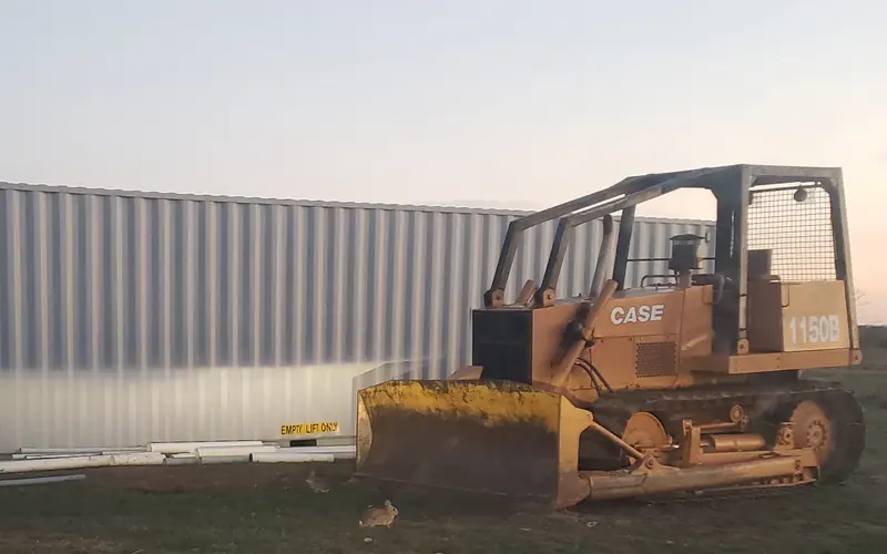 Jacksboro Services Case 1150B dozer and equipment container